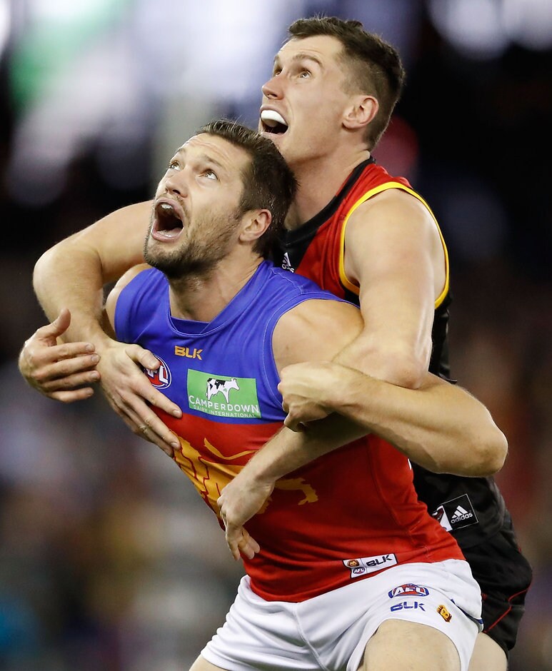 AFL 2016 Rd 18 - Essendon v Brisbane MELBOURNE, AUSTRALIA - JULY 24: Stefan Martin of the Lions and Matthew Leuenberger of the Bombers compete in a ruck contest during the 2016 AFL Round 18 match between the Essendon Bombers and the Brisbane Lions at Etihad Stadium on July 24, 2016 in Melbourne, Australia. (Photo by Adam Trafford/AFL Media)